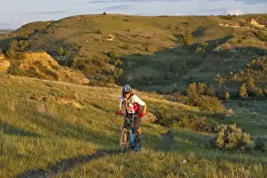 Images Dated 10th June 2009: Woman mountain bikes on the Maah Daah Hey Trail near Medora North Dakota (MR)