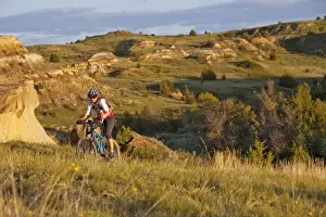 Images Dated 10th June 2009: Woman mountain bikes on the Maah Daah Hey Trail near Medora North Dakota (MR)