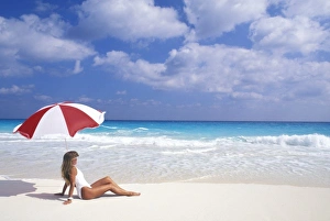 Solo Prints: Woman sitting on tropical beach with umbrella (MR)