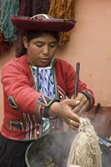Woman in traditional dress dying wool, Chinchero, Department of Cuzco, Peru. (MR)