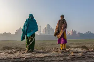 15th Century Prints: Women walking Mehtab Bagh, Moon Garden across from Taj Mahal in morning mist. Agra. India