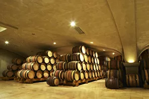 Images Dated 13th May 2004: Wooden barrels with aging wine in the cellar of Guigal in Ampuis. The vaulted roof