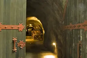 Shenandoah Valley Prints: Wooden door entrance to one of aging miners caves with oak barrels at Ironstone Winery