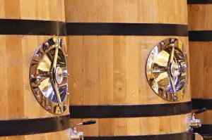 Warehouse Prints: Detail of wooden fermentation tanks vats with a polished stainless steel door
