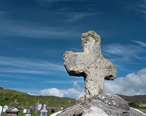 Grave Prints: Worn stone cross adorns a grave in Kildavnet, Achill Island, County Mayo, Ireland
