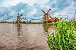 Windmill Prints: Zaanse Schans, Netherlands. Wide angle view of iconic Dutch tourist village which features six functioning windmills