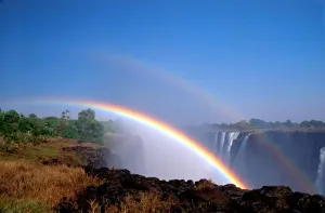 Zimbabwe, Victoria Falls National Park. Double rainbow over Victoria Falls