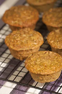 Homemade Prints: Zucchini muffins cooling on a wire rack above a striped tea towel